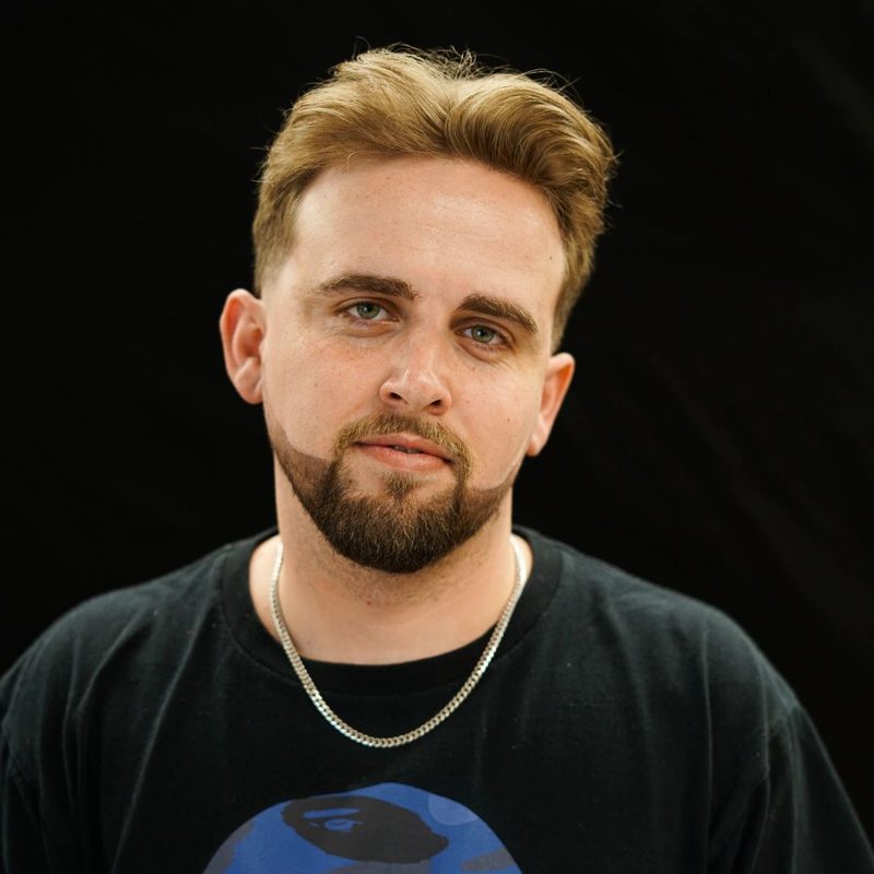 Chris L, photographed on the shop’s black backdrop.